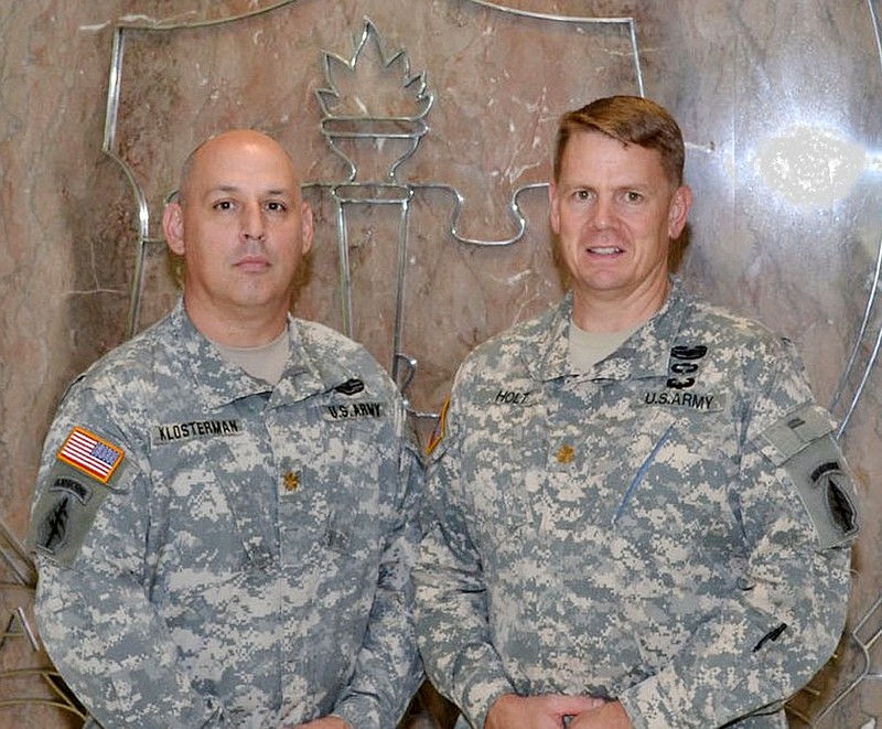 Maj. Jeff Klostermann, left, and Maj. Ned C. Holt, both 1987 graduates of Fulton High School, were reunited recently when they both were taking courses at the United States Joint & Combined Warfighting School at the Joint Staff College in Norfolk, Va.