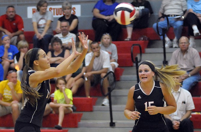 Jefferson City Lady Jay Abbi McKnelly returns as Mallory York encourages her against Hermann on Thursday evening in Fleming Fieldhouse.