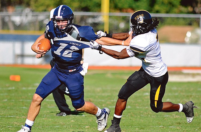 Lincoln quarterback Jacob Morris (12), shown here in a game last season against Fort Hays State, leads the Blue Tigers into their season opener against Lindenwood today. 