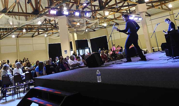 The Jefferson City-based Christian rock band Almost Taken performs for the crowd during the United As One Christian Festival at the Capital Events Center on Saturday.