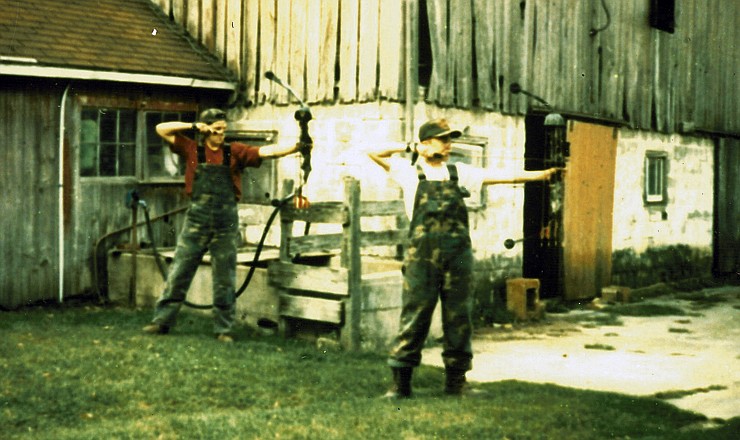 Brandon Butler (left) and his cousin, Derek Butler, practice in the barnyard they grew up hunting in, circa 1992.