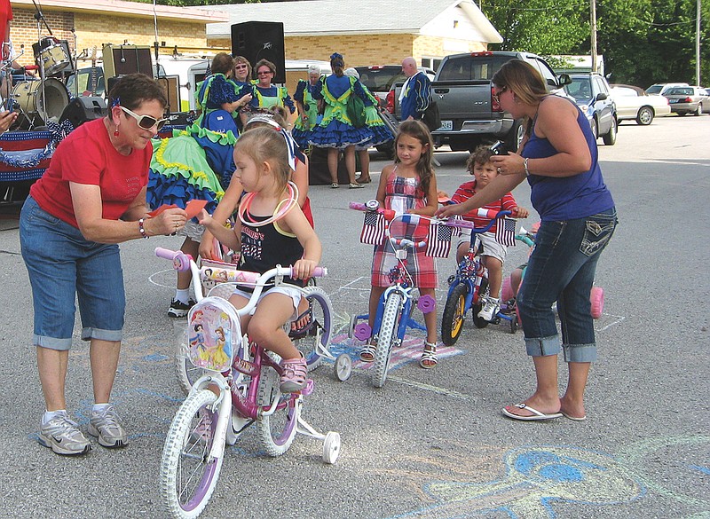 Children ride in the bike parade at New Bloomfield's annual Celebrate America event in 2011. This year's celebration, to be held Sept. 16, will include a storybook character parade for children.