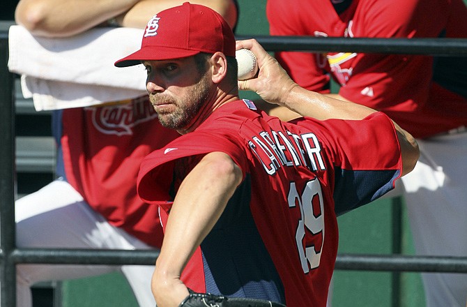 Cardinals pitcher Chris Carpenter warms up in the bullpen Tuesday at Busch Stadium.