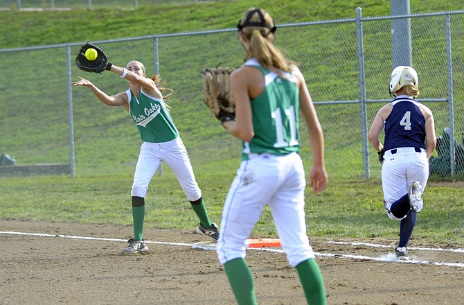 Blair Oaks second baseman Jolie Duffner steps off the bag to make a catch allowing Liz Czarnecki on base Tuesday at the Falcon Athletic Complex.
