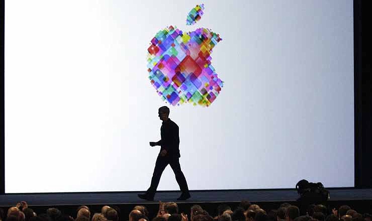 In this Monday, June 11, 2012, file photo, Apple CEO Tim Cook walks on stage during the Apple Developers Conference in San Francisco. Makers of consumer electronics are refreshing their products for the holiday shopping season.