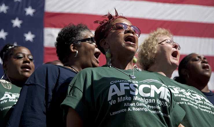 The Family Union Choir sings the Star Spangled Banner before the Vice President Joe Biden speaks at the Metro Detroit AFL-CIO Labor Day Rally, Monday, Sept. 3, 2012, in Detroit.