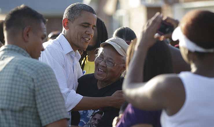 President Barack Obama greets local residents as he tours the Bridgewood neighborhood in LaPlace, La., in the Saint John the Baptist Parish for the ongoing response and recovery efforts to Hurricane Isaac, Monday, Sept. 3, 2012. 
