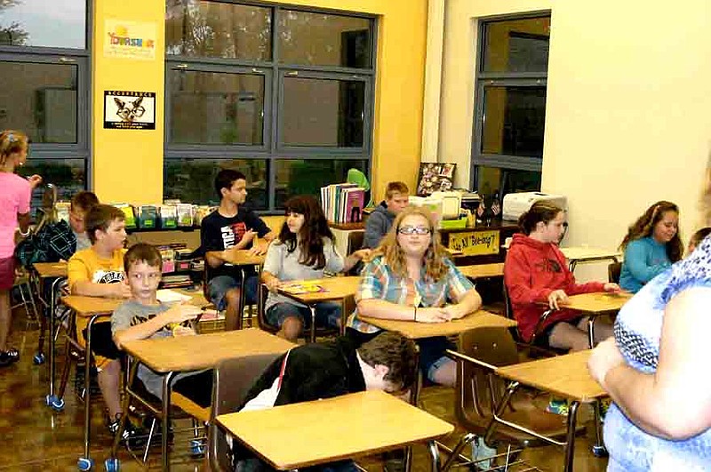 Latham students take their seats on the first day of school in Angie Shane's classroom.  