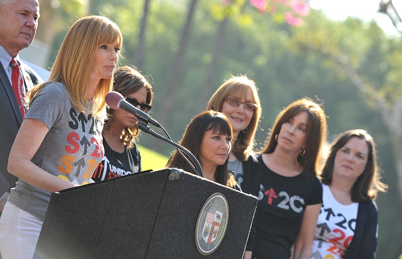 Actress Marg Helgenberger, left, appears Tuesday at the Stand Up To Cancer Day announcement at Los Angeles City Hall. Councilmember Paul Koretz and the City of Los Angeles held the news conference to declare Friday as the official "Stand Up To Cancer Day" in Los Angeles.