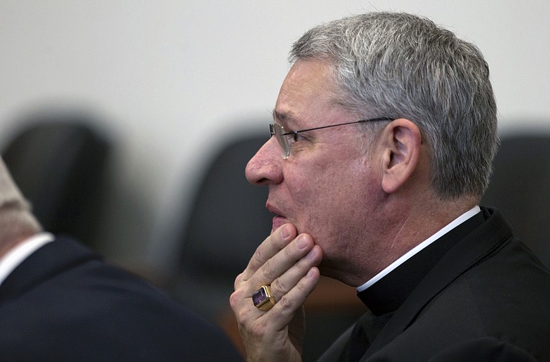 Bishop Robert Finn of the Diocese of Kansas City-St. Joseph appears in court Thursday during a bench trial at the Jackson County Courthouse in Kansas City. Following a short non-jury trial, Finn was convicted of one misdemeanor count of failing to report suspicions of child abuse.