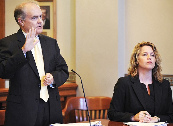James Layton, Missouri solicitor general and the state's principal appellate lawyer, speaks on behalf of Secretary of State Robin Carnahan in the the lawsuit challenging ballot language for Amendment 3 on the Nov. 6 general election ballot. Seated at right is attorney Heidi Doerhoff Vollet. 