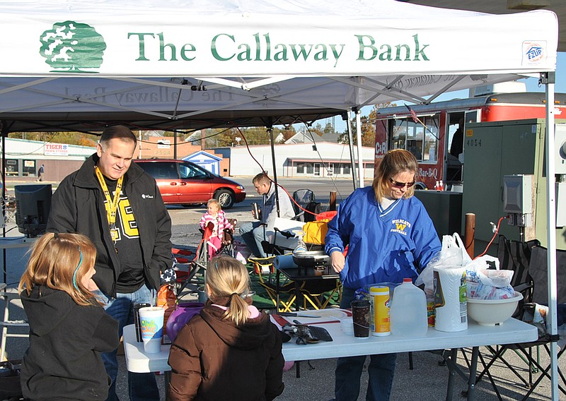 Mike Hill, treasurer of the Fulton Rotary Club, works the Callaway Bank booth during the 2011 chili cook-off. This year's cook-off features a restaurant category, and all proceeds will go to local charities.
