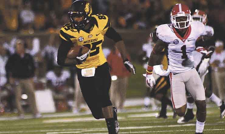 Missouri's Marcus Lucas races his way to an 81-yard touchdown reception during the second quarter of Saturday night's game with Georgia in Columbia. (Sarah Hoffman/News Tribune photo)