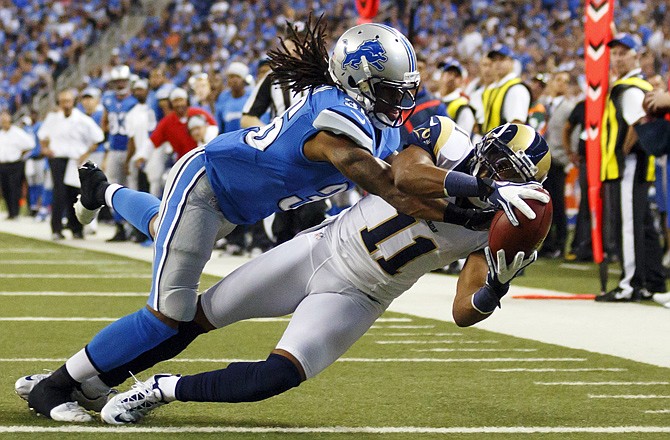 Rams wide receiver Brandon Gibson (11) makes a touchdown reception as Lions cornerback Jonte Green defends in the fourth quarter Sunday in Detroit. The Lions scored with 10 seconds left to defeat the Rams 27-23.