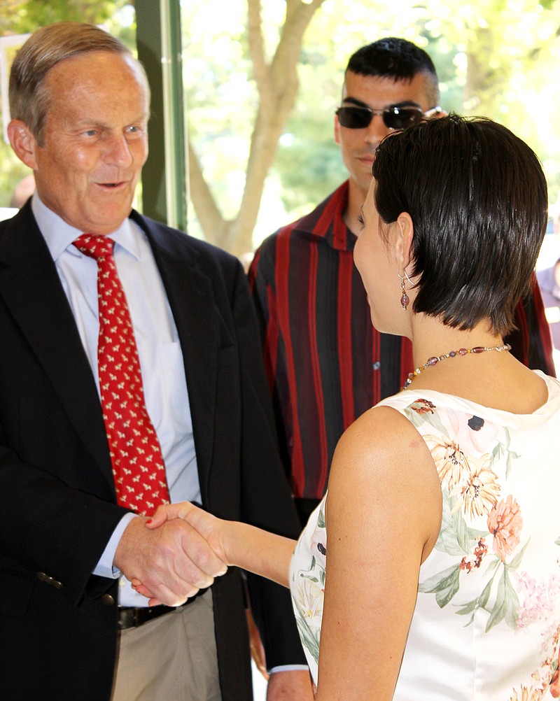 Congressman Todd Akin, Republican candidate for the U.S. Senate, is greeted by two members of College Republicans during his visit Tuesday at Westminster College in Fulton.