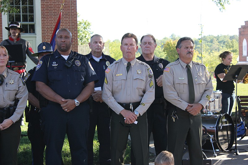  Members of the Fulton Police Department, Callaway County Sheriff's Office and other county law enforcement agencies stand before an ovational crowd Tuesday during the last Gray Ghost panel dedication at the Callaway County Courthouse. In addition to honoring George W. Law and celebrating the installation of the final panel on this phase of the Gray Ghosts Trail in Callaway, the ceremony gave thanks to local law enforcement agencies and first responders.