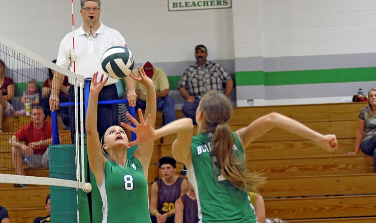 Blair Oak's Sarah Wilson sets the ball to Amanda Kiso during the Lady Falcons' win over Eldon on Tuesday in Wardsville.