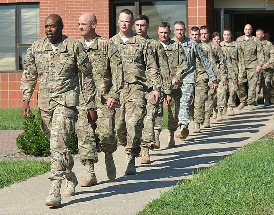 
Above, Lt. Col. Andre Edison leads his team into the courtyard area at Missouri National Guard Headquarters for a return home ceremony. The ADT VI team left in March of 2012 and was supposed to be gone for a year.