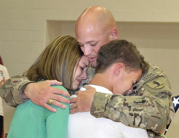 
Sgt. Maj. Mike Lederle surprises his children, Samantha and Trenton, at Southern Boone High School in Ashland.
