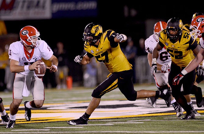 Missouri defensive end Brad Madison chases down Georgia quarterback Aaron Murray during the fourth quarter of Saturday's game against Georgia at Faurot Field. Madison had two sacks in the game.