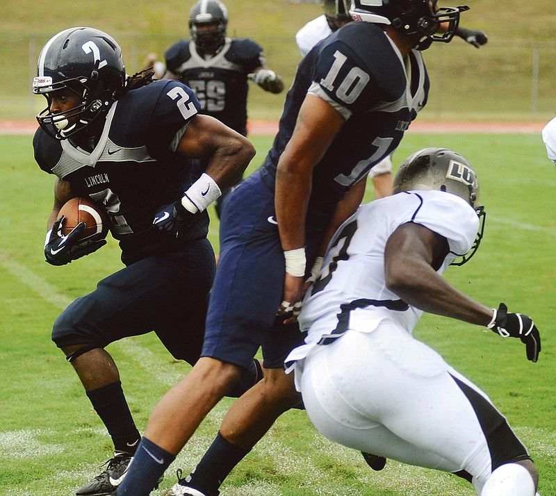Lincoln tailback Morris Henderson (2) finds a wide-open running lane thanks to a big block by wide receiver Khiry Draine against Lindenwood on Sept. 1 at Dwight T. Reed Stadium.