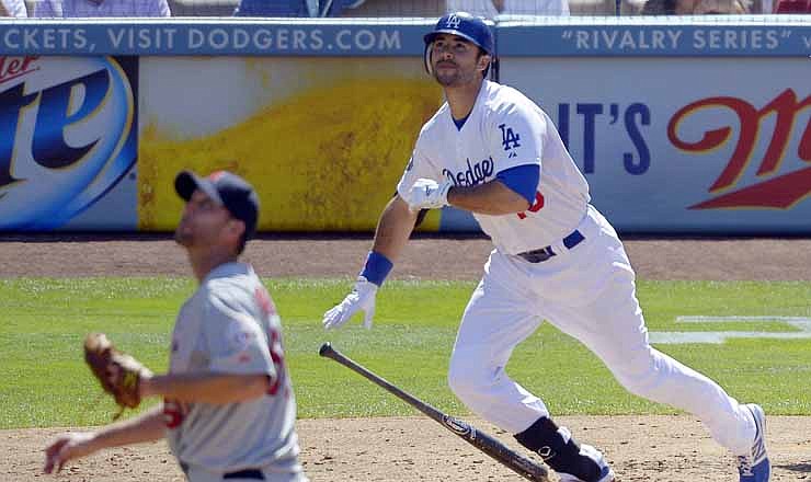 Los Angeles Dodgers' Andre Ethier, right, watches his ball go out for a two-run home run along with St. Louis Cardinals starting pitcher Adam Wainwright during the third inning of their baseball game, Sunday, Sept. 16, 2012, in Los Angeles. 