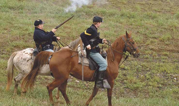 The Union troops make a charge Saturday afternoon toward Confederate and Militia forces as they re-enact the Battle of Monday's Hollow near the Lake of the Ozarks. The re-enactment will continue today.
