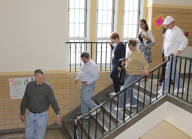 Back in school
(From left) Bill Sadler, class of 1967, Joe Roberts, class of "67, Debbie Butcher, Janet Erwin, class of "67 and Larry Sims, class of "67, head down a familiar set of stairs during an alumni tour of Fulton Middle School led by student council members Lizzie Russell and Alicia Donze (second and third from the right). The tours of the middle school, which used to be the high school, were a part of Fulton's homecoming weekend.
