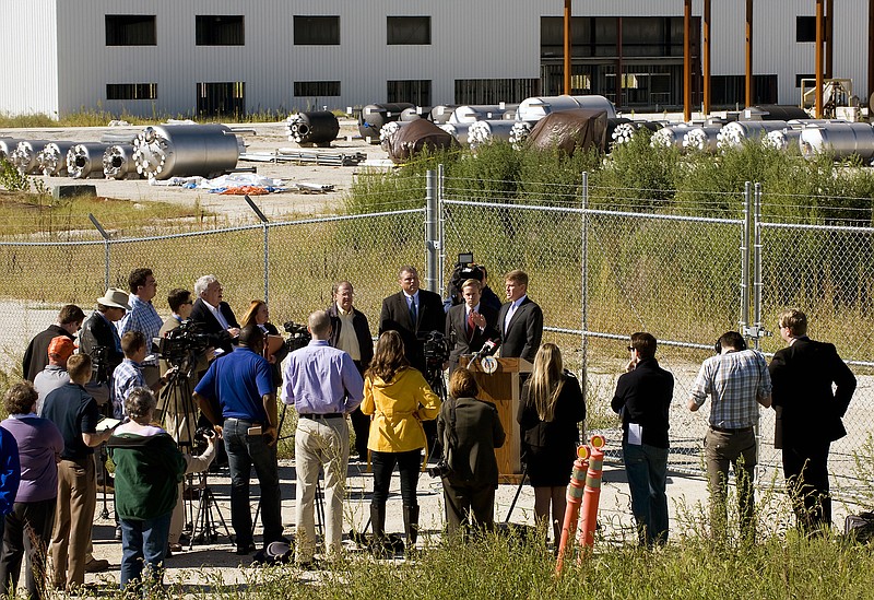 Missouri Attorney General Chris Koster, at lectern, announces felony charges Tuesday against former Mamtek U.S. CEO Bruce Cole outside the failed business in Moberly.