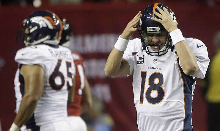 Denver Broncos quarterback Peyton Manning (18) reacts after being sacked by the Atlanta Falcons during the first half of an NFL football game, Monday, Sept. 17, 2012, in Atlanta.
