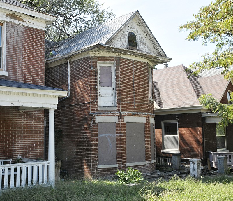 Old Town Revitalization Company recently purchased the vacant building at 614 E. McCarty St., structure in middle, and will raze the former residence. Adjacent property owners will then own it and care for it as a greenspace.