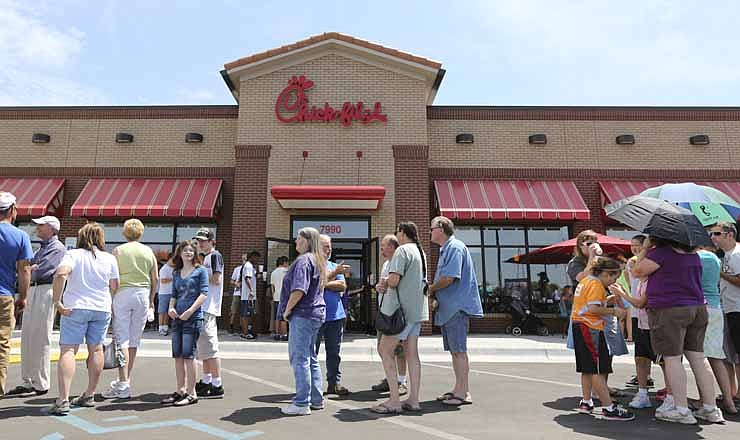 In an Aug. 1, 2012 file photo, customers stand in line for a Chick-fil-A meal at the chain's restaurant in Wichita, Kan. The crowd was buying meals to show their support for the company that became embroiled in a controversy over same-sex marriage. Chick-fil-A issued a statement this week that the company had stopped funding organizations that oppose same-sex marriage. 