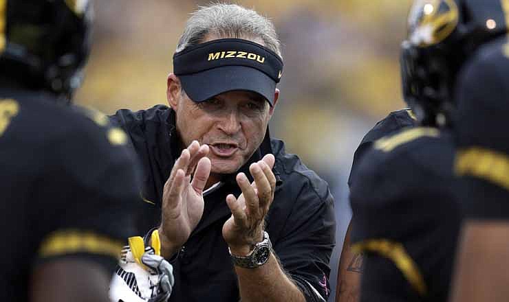 Missouri head coach Gary Pinkel applauds his team after a score during the first quarter of an NCAA college football game against Arizona State, Saturday, Sept. 15, 2012, in Columbia, Mo.