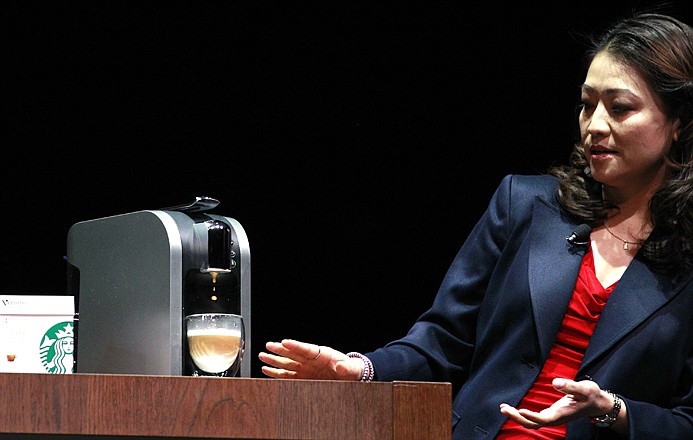 Hannah So demonstrates a "Verismo," a single-serving espresso machine, at the annual Starbucks shareholders meeting on March 21 in Seattle. The Seattle-based company says it will start selling its new single-serve brewer online this week.