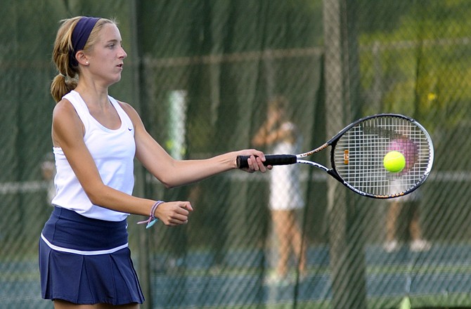 Lauren Highfill returns a shot during her doubles match Thursday at Washington Park. Helias defeated Rolla 8-1.