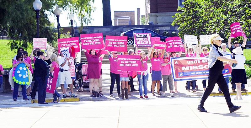 Protesters who called themselves Women against Akin demonstrated Friday across the street from the Missouri Women Standing with Akin Rally on the south side of the Capitol.