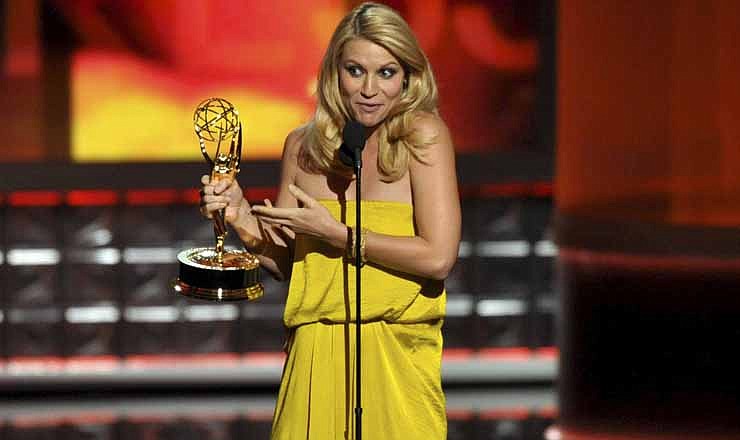 Claire Danes accepts the award for outstanding lead actress in a drama series for "Homeland" at the 64th Primetime Emmy Awards at the Nokia Theatre on Sunday, Sept. 23, 2012, in Los Angeles. (Photo by John Shearer/Invision/AP)