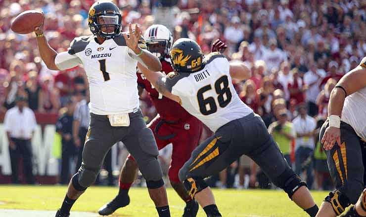 Missouri quarterback James Franklin drops back to pass during the first half of an NCAA college football game against South Carolina at Williams-Brice Stadium in Columbia, S.C., Saturday, Sept. 22, 2012.