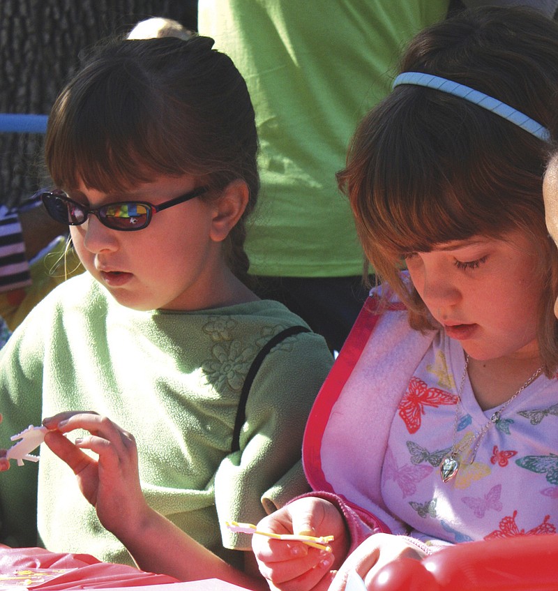 (left) Lydia Brandon, 9 and Kelly Gillespie, 9, at last year's Ashley Garrett Art Festival in Auxvasse. This year's event will feature a graffiti theme.
