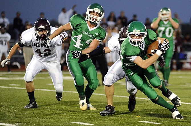 Hayden Lock of Blair Oaks moves up the field with the football during last Friday's game against School of the Osage at the Falcon Athletic Complex.