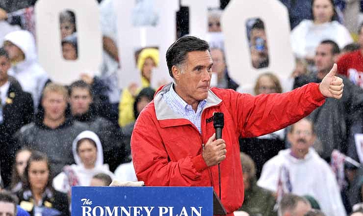 In this Sept. 14, 2012 file photo, Republican presidential candidate, former Massachusetts Gov. Mitt Romney campaigns in the rain at Lake Erie College in Painesville, Ohio. Ohio is the presidential race's undisputed epicenter. 