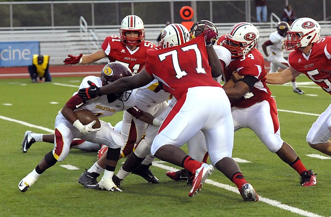 The Jays defense converges on a Hazelwood East running back in a game earlier this month at Adkins Stadium. On Friday, the Jays will try to contain Hickman's potent run game.