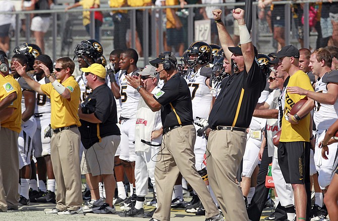 Missouri head coach Gary Pinkel (center) and others on the Tigers' bench celebrate Saturday as time runs out in a 21-16 victory over Central Florida in Orlando, Fla.