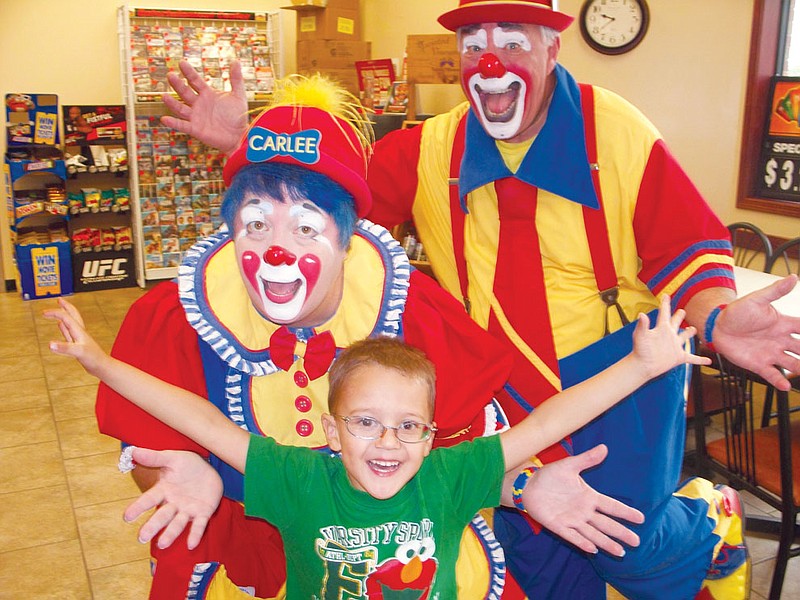 Four-year-old Thayne Nevels from Auxvasse visited the Kelly Miller Circus Clowns in Casey's General Store in Auxvasse Wednesday morning. The clowns started out their day with a "Meet and Greet" at United Security Bank, following with a visit to Casey's and onward to put a show at Auxvasse Elementary School for students K-5.