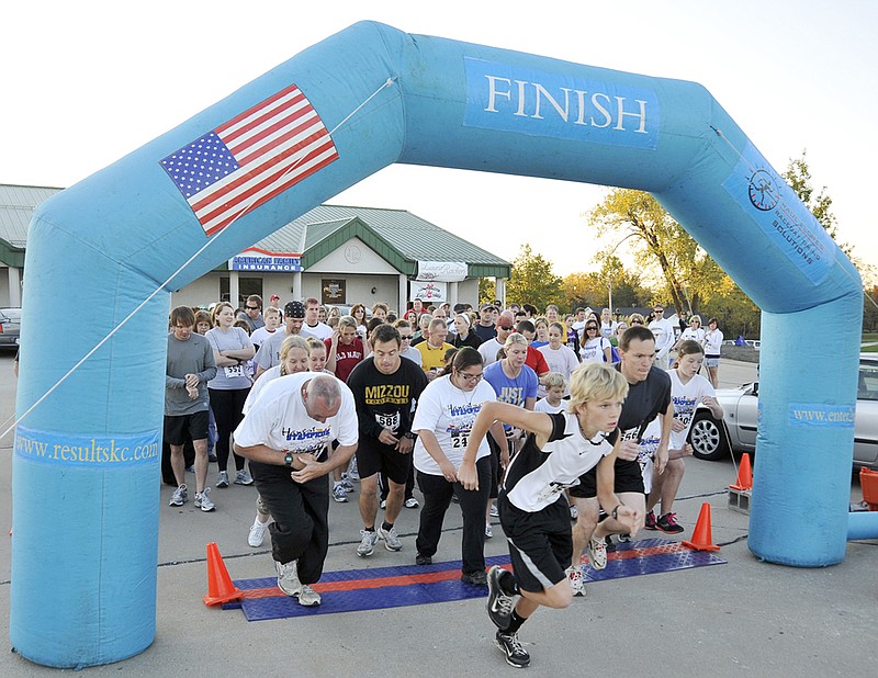 Cody Huhn, 14, bolts from the starting line at last year's North School PTO Harvest Stampede 5K Run/Walk in Holts Summit. The Harvest Stampede will return at this year's Holts Summit Harvest Festival Oct. 13.