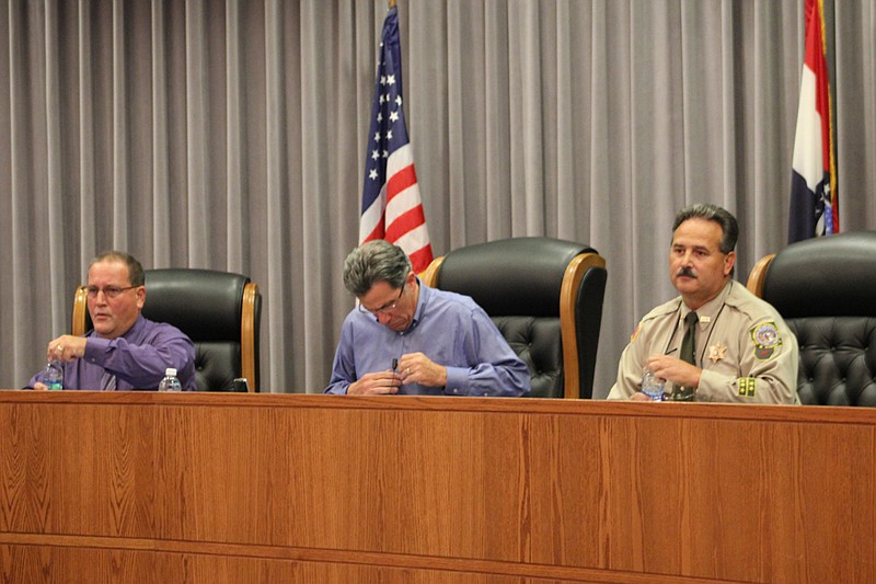 From left: Republican candidate Steve Anderson, moderator Steve Mallinckrodt and Democrat incumbent Dennis Crane prepare just prior to the Sheriff's candidate forum Thursday evening in the Fulton City Council Chambers.