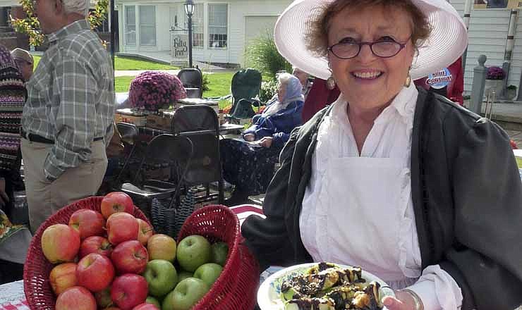 In this 2012 file photo, Doris Hilty, innkeeper at The Hilty Inn Bed and Breakfast in Versailles, shared a favorite apple treat with guests as part of the Versailles Apple Festival.