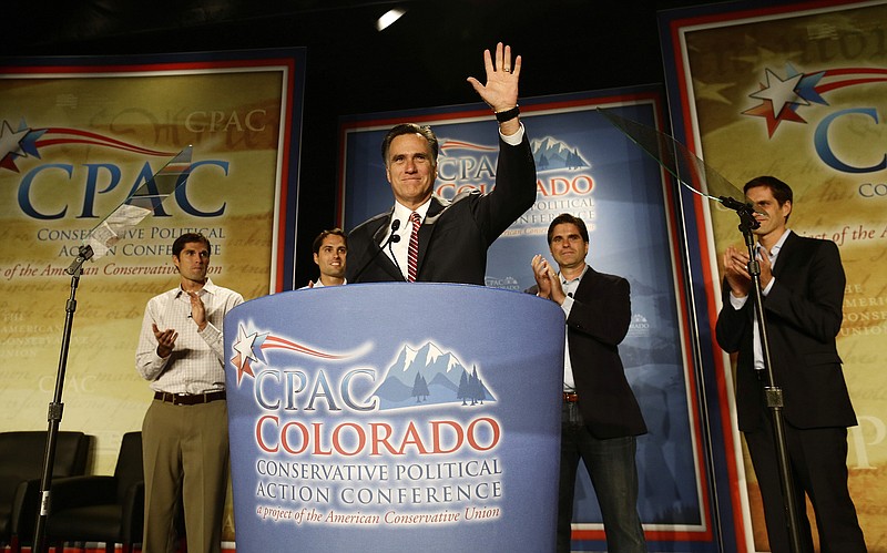 Republican presidential candidate former Massachusetts Gov. Mitt Romney speaks at a Colorado Conservative Political Action Committee (CPAC) meeting Thursday in Denver. At rear are sons Matt, Craig, Tagg and Josh Romney.