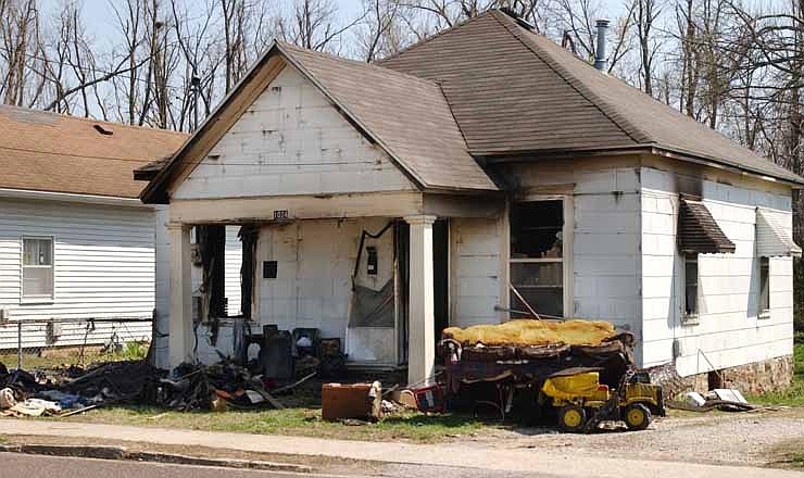 This 2008 photo shows a house in Springfield, Mo., where prosecutors said Jeffrey Allen Dickson left his victim, a 7-year-old girl, to die after setting it ablaze to cover up his crime. The girl survived and a Springfield jury quickly found Dickson guilty of child kidnapping, forcible rape and forcible sodomy in the April 5, 2008 attack. But new evidence unearthed by Dickson's state-appointed appeals court lawyer and reviewed as part of a five-month Associated Press investigation suggests that a rush to judgment could have caused police and prosecutors to target the wrong man. He is scheduled to argue his appeal on Tuesday and Wednesday, Oct. 10, 2012, in Springfield, Mo.