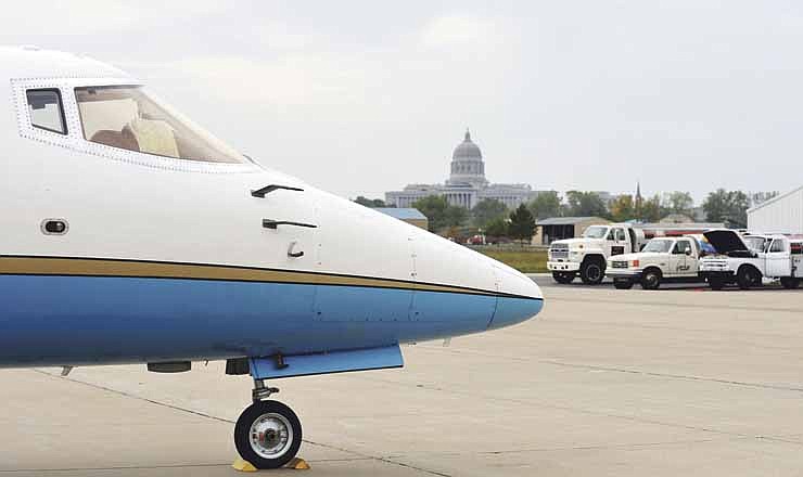 In this October 2012 photo, the nose of a Lear jet 60 is shown at Jefferson City Memorial Airport against the backdrop of Missouri's Capitol building. 
